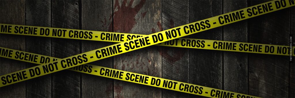 The UKCBC header which features crime scene tape across a distressed wooden panelled fence with blood stains